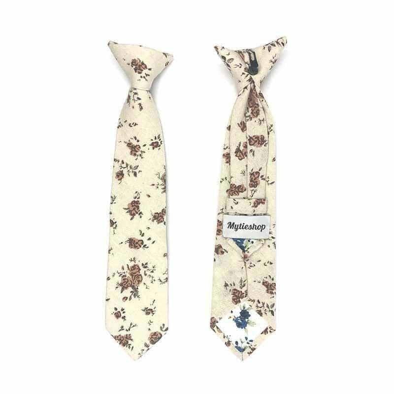 Beige Boys Floral Clip On Tie 2.3 Mytieshop - ERIC-Beige Boys Floral Clip On Tie Material:Cotton Blend Approx Size: Max width: 6.5 cm / 2.4 inches 9-24 months 26 CM2-5 years 31 CM9-11 Years 43 CM Spruce up your little one's wardrobe with this Boys Floral Clip On Tie. This boys tie is perfect for adding a touch of dapper to any outfit. Whether it's for a wedding, a family gathering, or a day at the office, this tie is sure to make your little one stand out from the rest. The clip-on design makes 