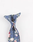 Boys Floral Clip On Tie 2.3" NEIL-Boys Floral Clip On Tie Material:Cotton Blend Approx Size: Max width: 6.5 cm / 2.4 inches 9-24 months 26 CM2-5 years 31 CM9-11 Years 43 CM Get your little man looking sharp with this blue floral print tie. This dapper clip-on tie is perfect for any formal occasion, from weddings to christenings. The blue floral print is just the right amount of dainty, and the fit is tailored to fit boys of all ages. With a versatile style that can be dressed up or down, this ti