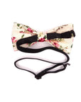 Cream Kids Floral Pre-Tied Bow Tie - EMMETT-Cream Kids Floral Pre-Tied Bow Tie Give your little one a dapper look with our EMMETT kids bow tie. This sweet floral bow tie is perfect for special occasions or just dressing up a everyday outfit. With a pre-tied design, it's easy to put on and take off, and it stays in place all day long. Whether you're dressing your son or daughter for a wedding or just want to add a touch of personality to their outfit, our EMMETT kids bow tie is the perfect option