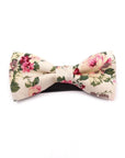 Cream Kids Floral Pre-Tied Bow Tie - EMMETT-Cream Kids Floral Pre-Tied Bow Tie Give your little one a dapper look with our EMMETT kids bow tie. This sweet floral bow tie is perfect for special occasions or just dressing up a everyday outfit. With a pre-tied design, it's easy to put on and take off, and it stays in place all day long. Whether you're dressing your son or daughter for a wedding or just want to add a touch of personality to their outfit, our EMMETT kids bow tie is the perfect option