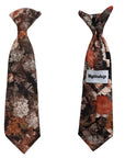 Spruce up your little one's wardrobe with this Boys Floral Clip On Tie. This boys tie is perfect for adding a touch of dapper to any outfit. Whether it's for a wedding, a family gathering, or a day at the office, this tie is sure to make your little one stand out from the rest. The clip-on design makes it easy to put on and take off, even for the littlest of gentlemen. And the floral pattern is sure to add a touch of personality to any outfit. Theophilus floral tie mytieshop