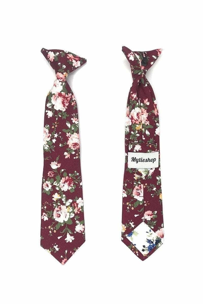 Kids Floral Clip On Tie in Burgundy 2.3” Mytieshop - WESLEY-Kids Floral clip on tie and chiidren. WESLEY burgundy Floral Clip On Tie. Material: Cotton Blend Approx Size: Width of ties: 6.5 cm / 2.4 inches Availble sizes: 9-24 months 26 CM (10.20 Inches in Length) 2-6years 31 CM (12.20 Inches in Length) 7-12 Years 43CM (16.92 Inches in Length) Color: Burgundy Looking for the perfect finishing touch for your child&#39;s outfit? Our Wesley burgundy Floral Clip On Tie is just what you need. This adorabl