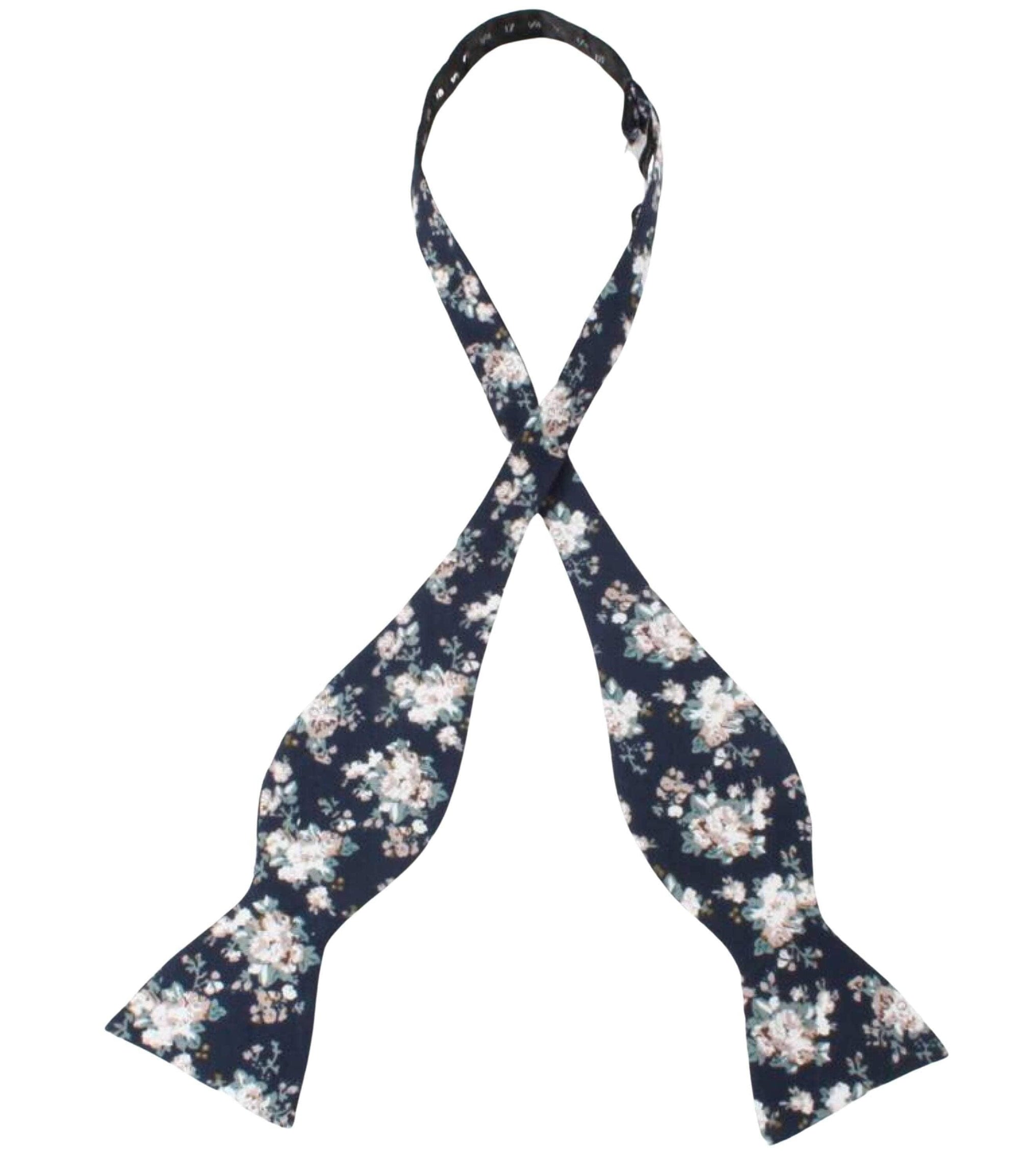 Navy Floral Bow Tie Self Tie FINLEY - MYTIESHOP Blue-Navy Floral Bow Tie 100% Cotton Flannel Handmade Adjustable to fit most neck sizes 13 3/4" - 18" Elevate your style and make a statement with this navy blue bow tie. With a versatile navy color and blue floral print, this bow tie is perfect for any formal event. Grooms, weddings, and formal affairs come to mind - but this bow tie can be dressed down for a more relaxed look as well. With a self-tie design, this bow tie is easy to put on and tak