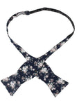 Navy Floral Bow Tie Self Tie FINLEY - MYTIESHOP Blue-Navy Floral Bow Tie 100% Cotton Flannel Handmade Adjustable to fit most neck sizes 13 3/4" - 18" Elevate your style and make a statement with this navy blue bow tie. With a versatile navy color and blue floral print, this bow tie is perfect for any formal event. Grooms, weddings, and formal affairs come to mind - but this bow tie can be dressed down for a more relaxed look as well. With a self-tie design, this bow tie is easy to put on and tak