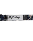 Navy Floral Bow Tie Self Tie FINLEY - MYTIESHOP Blue-Navy Floral Bow Tie 100% Cotton Flannel Handmade Adjustable to fit most neck sizes 13 3/4" - 18" Elevate your style and make a statement with this navy blue bow tie. With a versatile navy color and blue floral print, this bow tie is perfect for any formal event. Grooms, weddings, and formal affairs come to mind - but this bow tie can be dressed down for a more relaxed look as well. With a self-tie design, this bow tie is easy to put on and tak