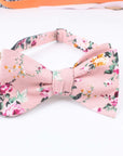 Pink Floral Bow Tie Self Tie MILLIE MYTIESHOP-You'll be the best dressed groom and groomsmen with this pink salmon bow tie. A must-have for the groomsmen, this pink salmon bow tie is perfect for any formal occasion. With its light pink and green floral print, this bow tie is sure to add personality to any outfit. Get ready to tie the knot in style with this self-tie bow tie.-Mytieshop