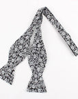 Suede Self Tie Bow Tie Mytieshop - ROSE-100% Cotton Flannel Handmade Adjustable to fit most neck sizes 13 3/4" - 18" Black base with white flowers Great for: Groom Groomsmen Wedding Shoots Formal Prom Fancy Parties Gifts and presents-Mytieshop