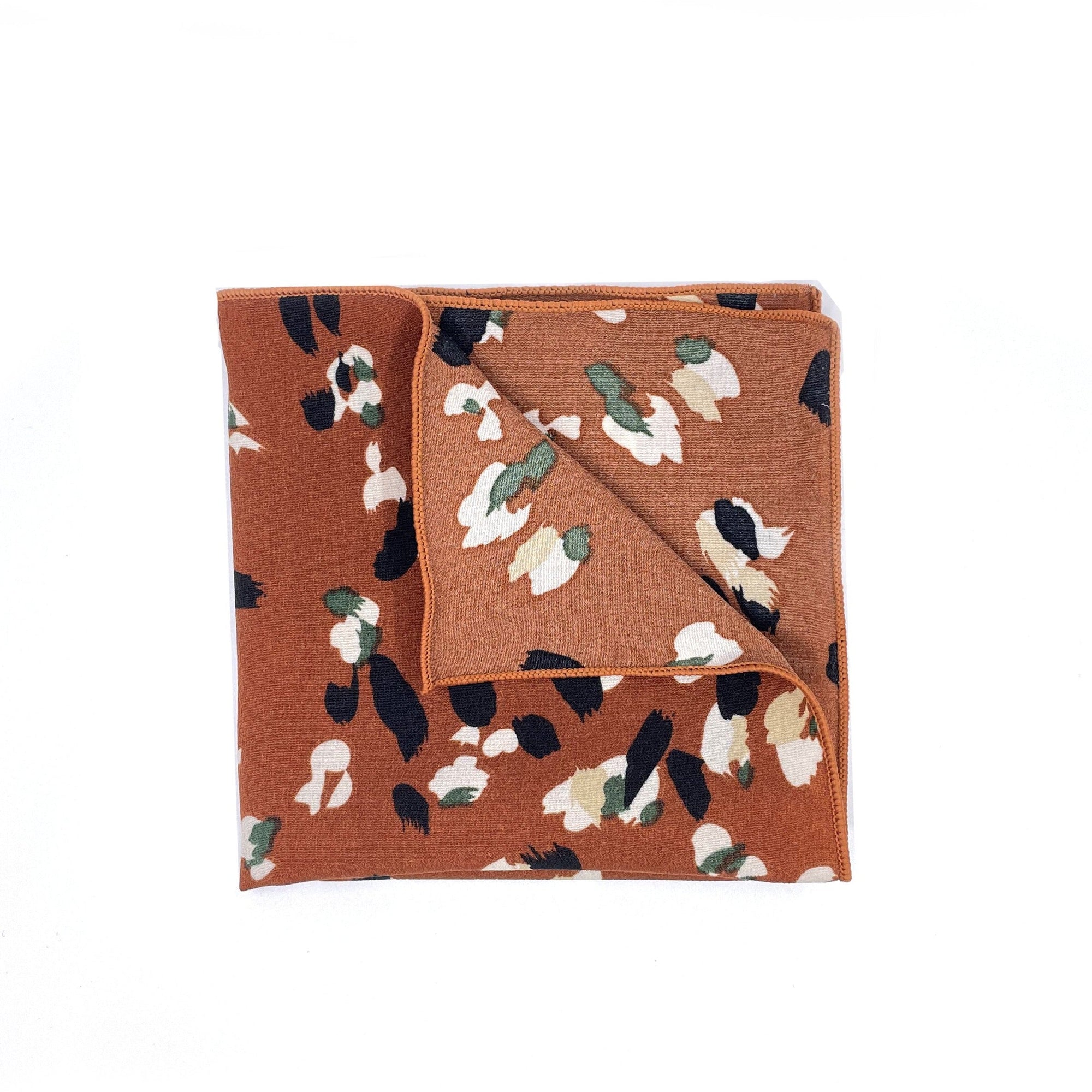 Terracotta Floral Pocket Square - Mytieshop - PHOEBE T Mytieshop Terracotta Floral Pocket Square Material CottonItem Length: 23 cm ( 9 inches)Item Width : 22 cm (8.6 inches) Color: Terracotta The PHOEBE is the perfect accessory to add a touch of elegance to your outfit. Made of 100% Silk, this pocket square is sure to make a statement. The intricate floral design is eye-catching and will surely turn heads. Whether you're dressing up for a special occasion or simply want to add a touch of sophist