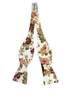 White Floral Bow Tie Self Tie IADA-White Floral Bow Tie Self Tie 100% Cotton Flannel Handmade Adjustable to fit most neck sizes 13 3/4" - 18" Color: White White floral Self tie Bow tie with pink, burgundy, red and green flowers. Great for the groom and groomsmen to wear for the weddings. Floral Self tie bow tie for weddings and events. Great anniversary present and gift. Also great gift for the groom and his groomsmen to wear at the wedding. Great for Prom Dinners Interviews Photo shoots Photo s