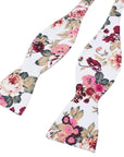 White Floral Bow Tie Self Tie IADA-White Floral Bow Tie Self Tie 100% Cotton Flannel Handmade Adjustable to fit most neck sizes 13 3/4" - 18" Color: White White floral Self tie Bow tie with pink, burgundy, red and green flowers. Great for the groom and groomsmen to wear for the weddings. Floral Self tie bow tie for weddings and events. Great anniversary present and gift. Also great gift for the groom and his groomsmen to wear at the wedding. Great for Prom Dinners Interviews Photo shoots Photo s