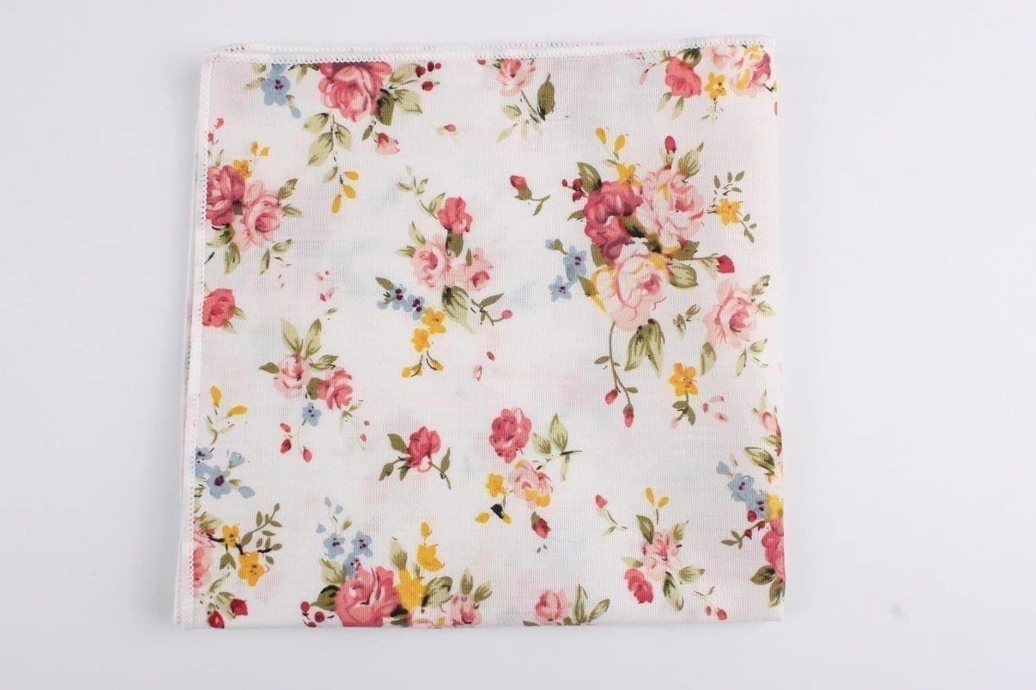 White Floral Pocket Square BENJAMIN Mytieshop White Floral Pocket Square Material CottonItem Length: 23 cm ( 9 inches)Item Width : 22 cm (8.6 inches) BENJAMIN Floral Pocket Square is the perfect accessory for any gentleman. This pocket square features a white floral print that is perfect for any occasion. Whether you are dressing up for a formal event or just adding a touch of style to your everyday look, this pocket square is a great way to do it. Great For: Weddings elopements Engagements Phot