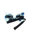 White Floral Pre-Tied Bow Tie Mytieshop - SAGE-Size: SmallStrap is 32CM Long (10-18 Inches)Pre-Tied bowtieBow Tie 12CM * 6CM Great for: Weddings events Photography ring bearers A dainty and sweet bow tie for your little ring bearer. This white bow tie has a delicate floral print in sage green, perfect for a baby boy or as a ring bearer. The bow tie is pre-tied, making it easy to wear, and is made of cotton for a comfortable fit. Whether your little guy is taking part in a formal wedding or just