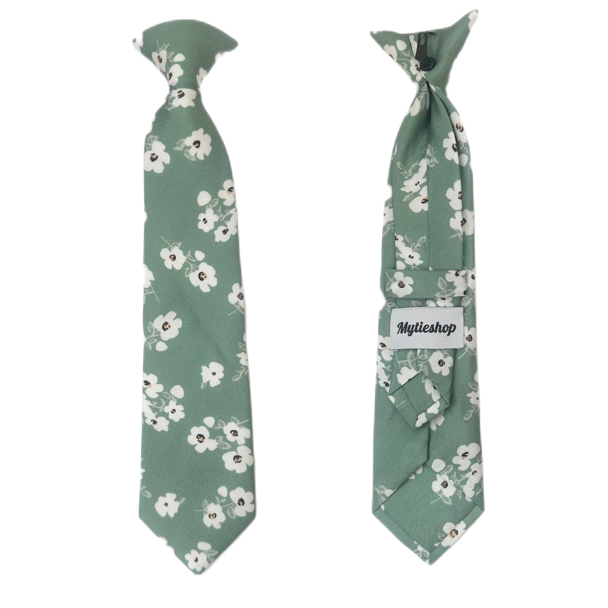 Green Floral Tie for kids Material:Cotton Blend Approx Size: Max width: 6.5 cm / 2.4 inches 9-24 months 26 CM 2-5 years 31 CM 9-11 Years 43 CM Color: Green Great for: Prom Dinners Interviews Photo shoots Photo sessions Dates Engagement pictures Western weddings Floral Cotton necktie for babies and kids for weddings and events. 