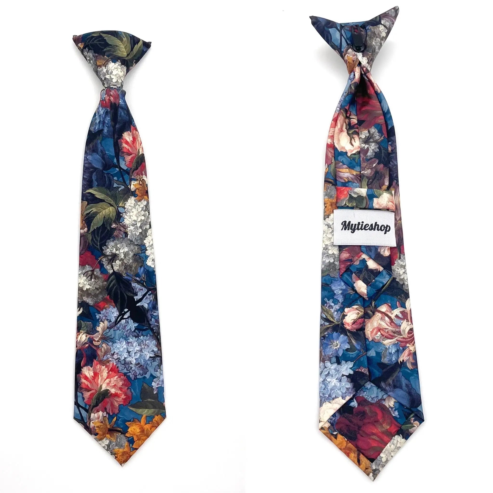 Blue Floral Boys Floral Clip On Tie 2.36 MYTIESHOP - HAMILTON-Blue Floral Boys Floral Clip On Tie - Clip on ties for kids Material: Cotton Approx Size: Color: Blue Max width: 6.5 cm / 2.4 inches 9-24 months 26 CM2-5 years 31 CM9-11 Years 43 CM To infuse a vibrant touch into your little one's attire, consider incorporating the Hamilton Boys Floral Clip On Tie. This versatile accessory is an excellent choice for various formal occasions, ranging from weddings to family gatherings. With its conveni