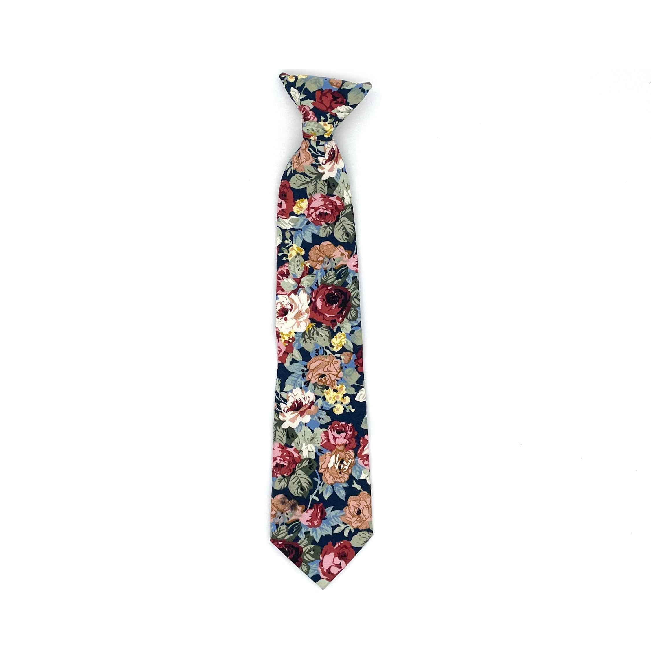 Blue Floral Boys Floral Clip On Tie 2.36 by Mytieshop - EVANDER-Blue Floral Boys Floral Clip On Tie Material: Cotton Blend Approx Size: Color: Blue Max width: 6.5 cm / 2.4 inches Available sizes: 2-5 years 31 CM Great for Prom Dinners Interviews Photo shoots Photo sessions Dates Wedding Attendant Ring Bearers tie. Fits boys and kids. bow tie floral for wedding and events groom groomsmen flower bow tie mytieshop ring bearer page boy bow tie white bow tie white and blue tie kids bowtie floral boys