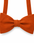 Rust Orange Bow Tie Self Tie SAFFRON MYTIESHOP-Rust Orange Bow Tie 100% Suede Handmade Adjustable to fit most neck sizes 13 3/4" - 18" Make a dapper statement at your next formal event with this rust orange bow tie. Handcrafted from premium suede, this bow tie has a luxurious feel that will have you looking and feeling your best. The perfect accessory for fall weddings, this bow tie will add a touch of sophistication to your outfit. Whether you're the groom or a member of the wedding party, this