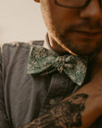 COOPER Self Tie Bow Tie-Green Floral Bow Tie self tie 100% Cotton Flannel Color: Green Adjustable to fit most neck sizes 13 3/4" - 18" Up your style game with this COOPER Self Tie Bow Tie. This bow tie is perfect for adding a touch of personality and flair to your outfit. Whether you're dressing up for a wedding or just want to add a pop of color, this bow tie is perfect for any occasion. The self-tie design means you can adjust it to get the perfect fit every time. The blue floral print is perf