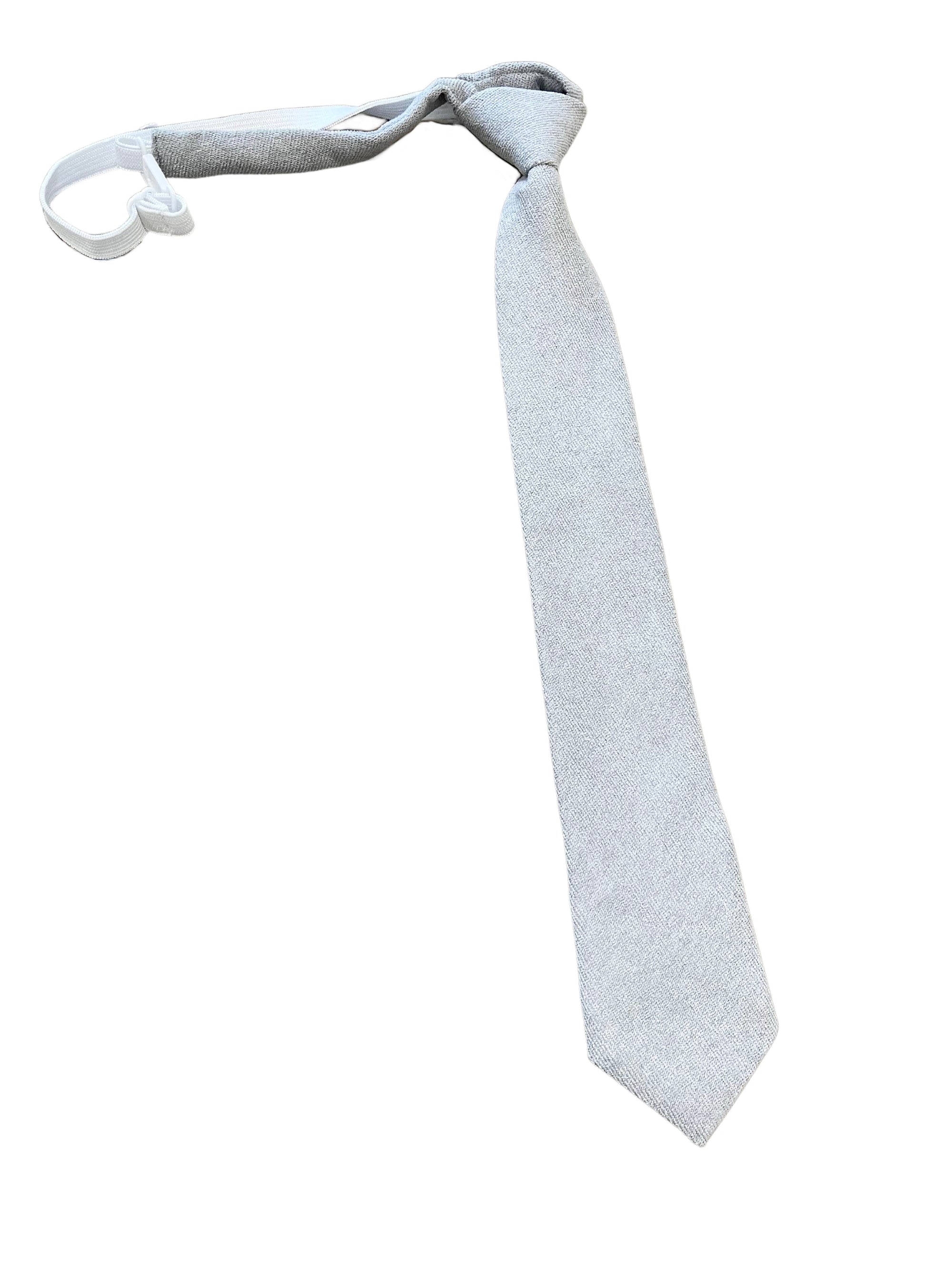 Gray Strap on Tie for Kids and Children ASTOR MYTIESHOP-Gray Strap on Tie for kids Material: Cotton Blend Color: Gray Approx Size: Max width: 6.5 cm / 2.4 inches Length: 14.56 Inches Looking for a stylish and convenient way to dress your little man for a special occasion? This clip on tie from ASTOR Kids is perfect for boys of all ages! Made from high quality materials, this tie is perfect for weddings, ring bearer duties, or any other formal event. The gray clip on tie is easy to put on and tak