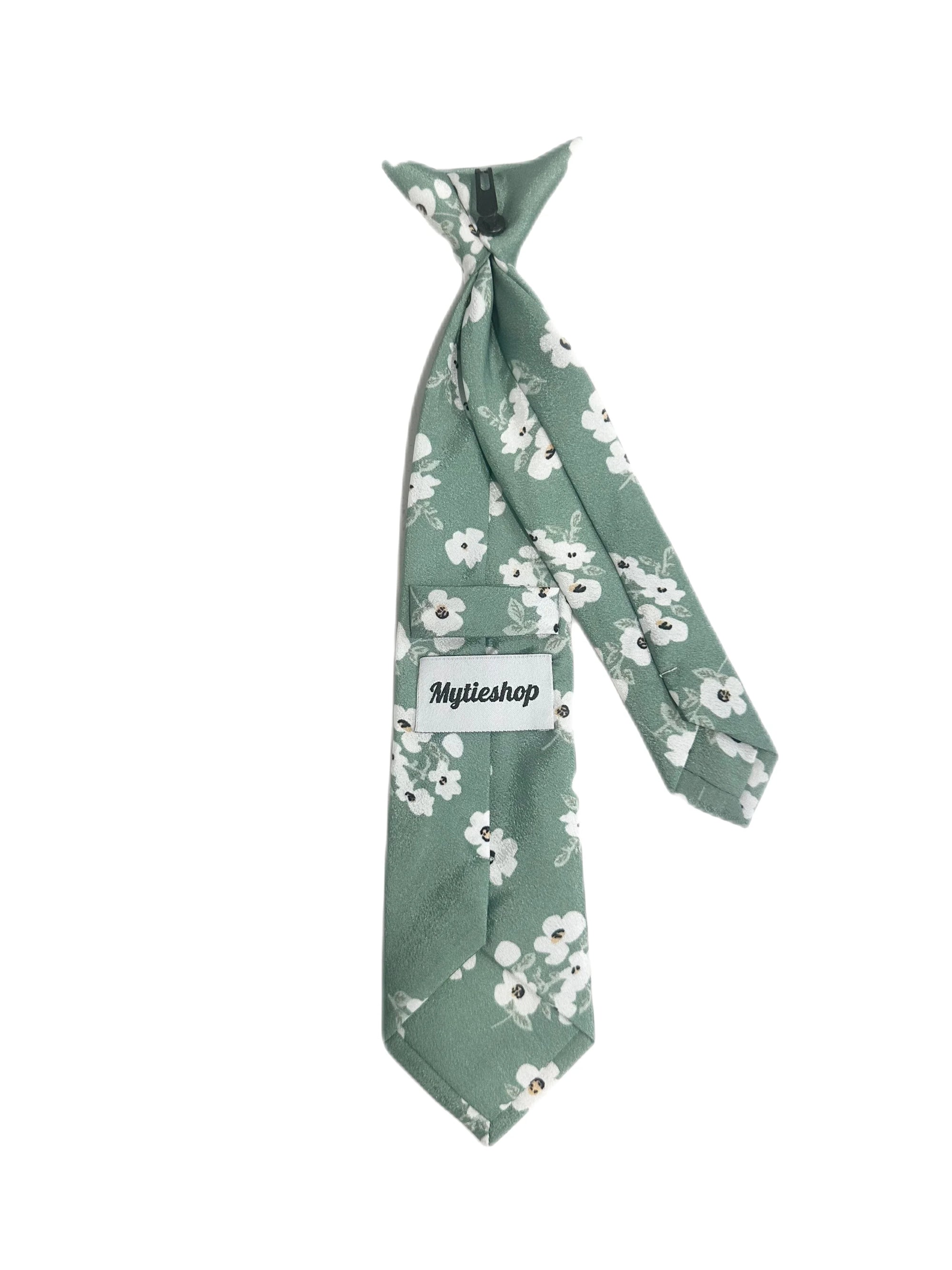 Green Floral Tie for kids Material:Cotton Blend Approx Size: Max width: 6.5 cm / 2.4 inches 9-24 months 26 CM 2-5 years 31 CM 9-11 Years 43 CM Color: Green Great for: Prom Dinners Interviews Photo shoots Photo sessions Dates Engagement pictures Western weddings Floral Cotton necktie for babies and kids for weddings and events. 