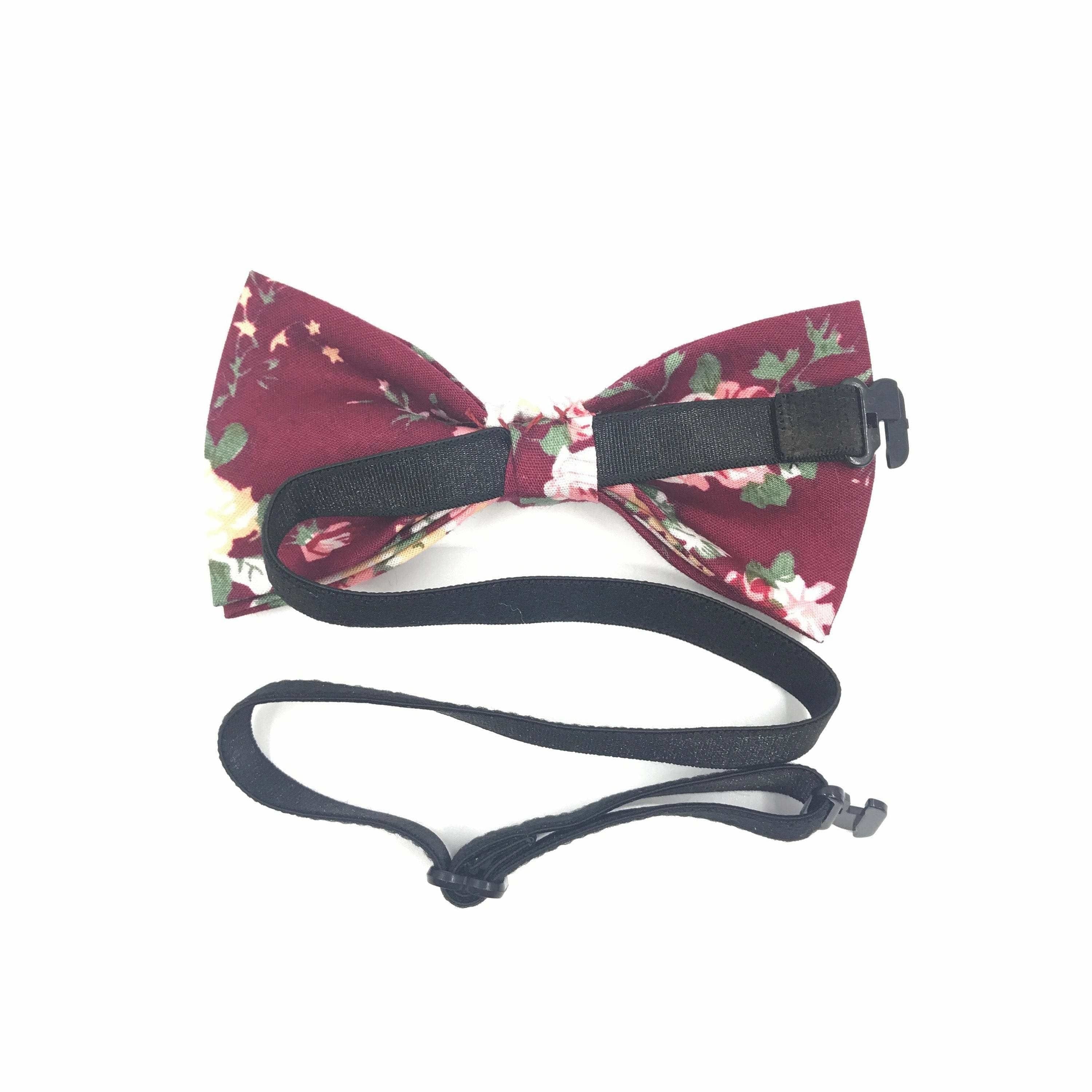 Kids Bow Tie Floral Pre-Tied Bow Tie WESLEY- MYTIESHOP-Floral Kid&#39;s bow tie - Wesley Strap is adjustablePre-Tied bowtieBow Tie 10.5 * 6CM Color: Burgundy Your little gentleman will look dapper in this burgundy floral bow tie. This pre-tied bow tie comes in a range of sizes to fit your child perfectly. The vibrant flowers against the dark background make this tie a stand-out piece. Add this bow tie to your child&#39;s wardrobe for a special occasions or even just to add a touch of refinement to their