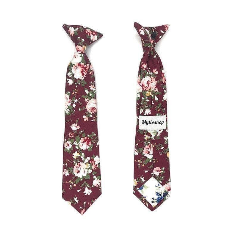 Kids Floral Clip On Tie in Burgundy 2.3” Mytieshop - WESLEY-Kids Floral clip on tie and chiidren. WESLEY burgundy Floral Clip On Tie. Material: Cotton Blend Approx Size: Width of ties: 6.5 cm / 2.4 inches Availble sizes: 9-24 months 26 CM (10.20 Inches in Length) 2-6years 31 CM (12.20 Inches in Length) 7-12 Years 43CM (16.92 Inches in Length) Color: Burgundy Looking for the perfect finishing touch for your child&#39;s outfit? Our Wesley burgundy Floral Clip On Tie is just what you need. This adorabl