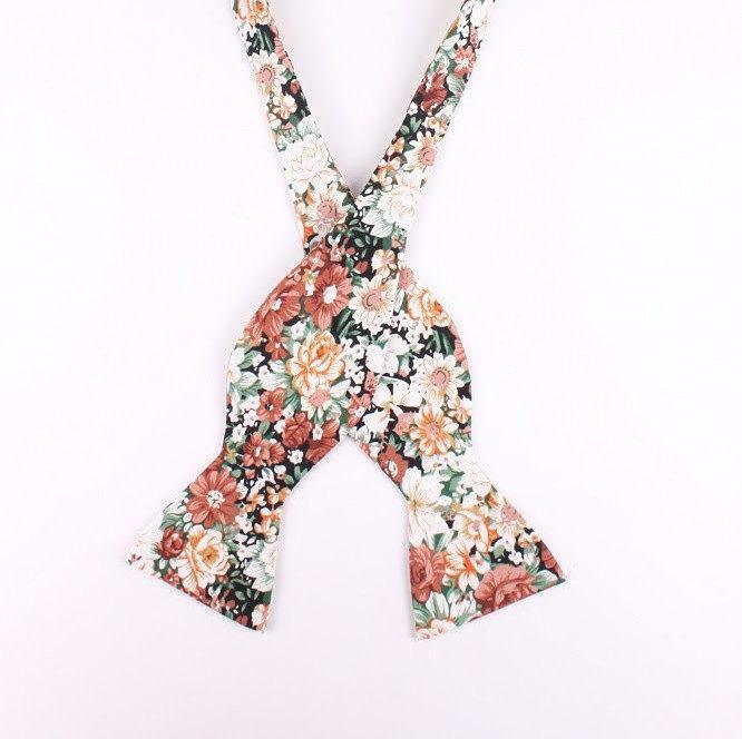 Orange Floral Bow Tie Self Tie PEACH Mytieshop-Orange floral bow tie Peach Tea Bow Tie 100% Cotton Flannel Handmade Adjustable to fit most neck sizes 13 3/4" - 18" Color: Orange and Black Great for Prom Dinners Interviews Photo shoots Photo sessions Dates Groom to stand out between his Groomsmen pair them up with neckties while he wears the bow tie. Floral self tie bow tie for weddings and events. Great anniversary present and gift. Also great gift for the groom and his groomsmen to wear at the 