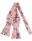 Pink Floral Bow Tie Self Tie MILLIE MYTIESHOP-You'll be the best dressed groom and groomsmen with this pink salmon bow tie. A must-have for the groomsmen, this pink salmon bow tie is perfect for any formal occasion. With its light pink and green floral print, this bow tie is sure to add personality to any outfit. Get ready to tie the knot in style with this self-tie bow tie.-Mytieshop