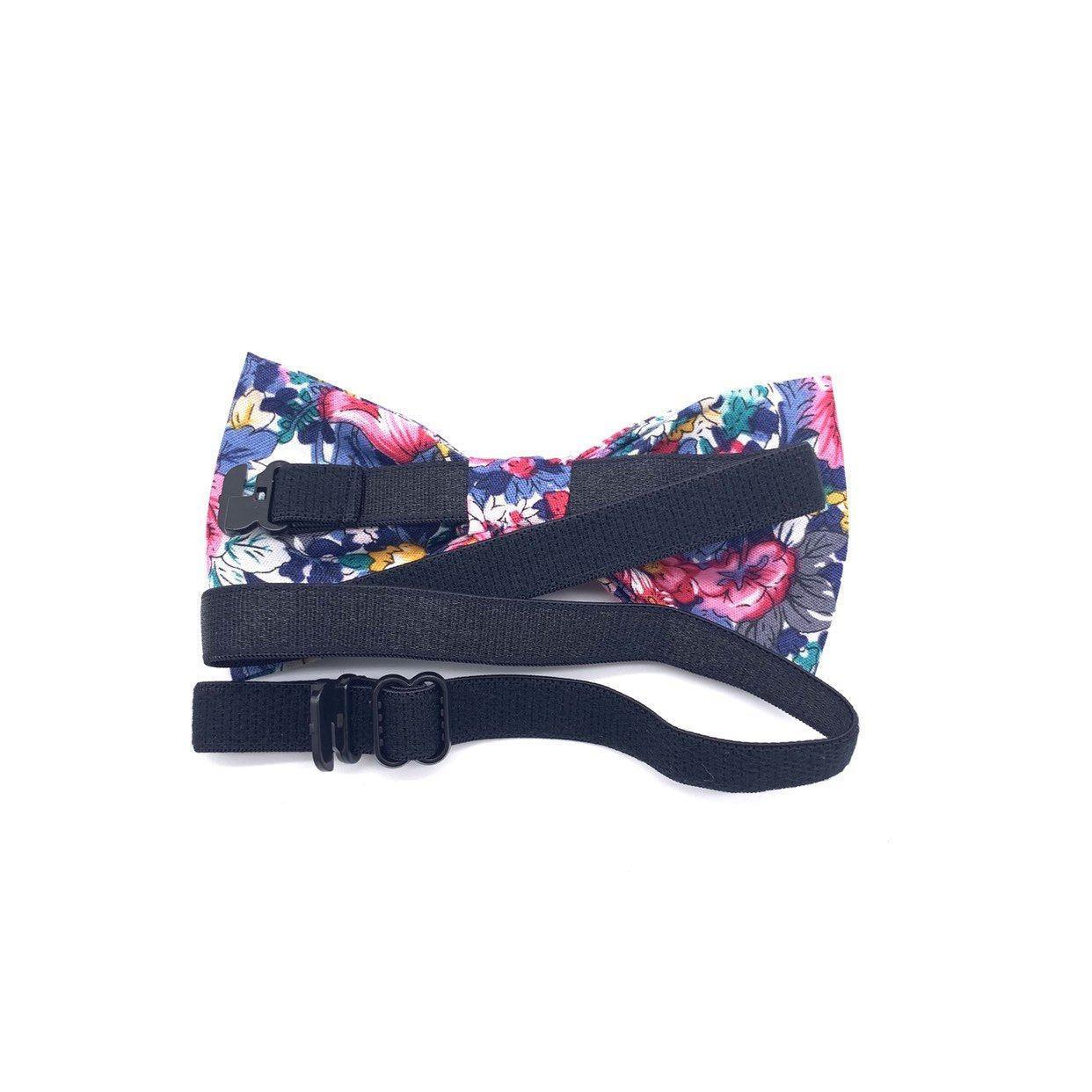 Pink Kids Floral Pre-Tied Bow Tie (ROBERT)-Make dressing up a breeze with our pre-tied bow tie. This dapper bow tie is perfect for any special occasion. With a sweet floral print and a playful green color, it's sure to add a touch of fun to your little one's outfit. With an adjustable neckband and easy-to-use clip closure, our bow tie is a breeze to put on and take off. So whether it's for a party or just for everyday wear, your child is sure to love our ROBERT tie. Strap is adjustablePre-Tied b