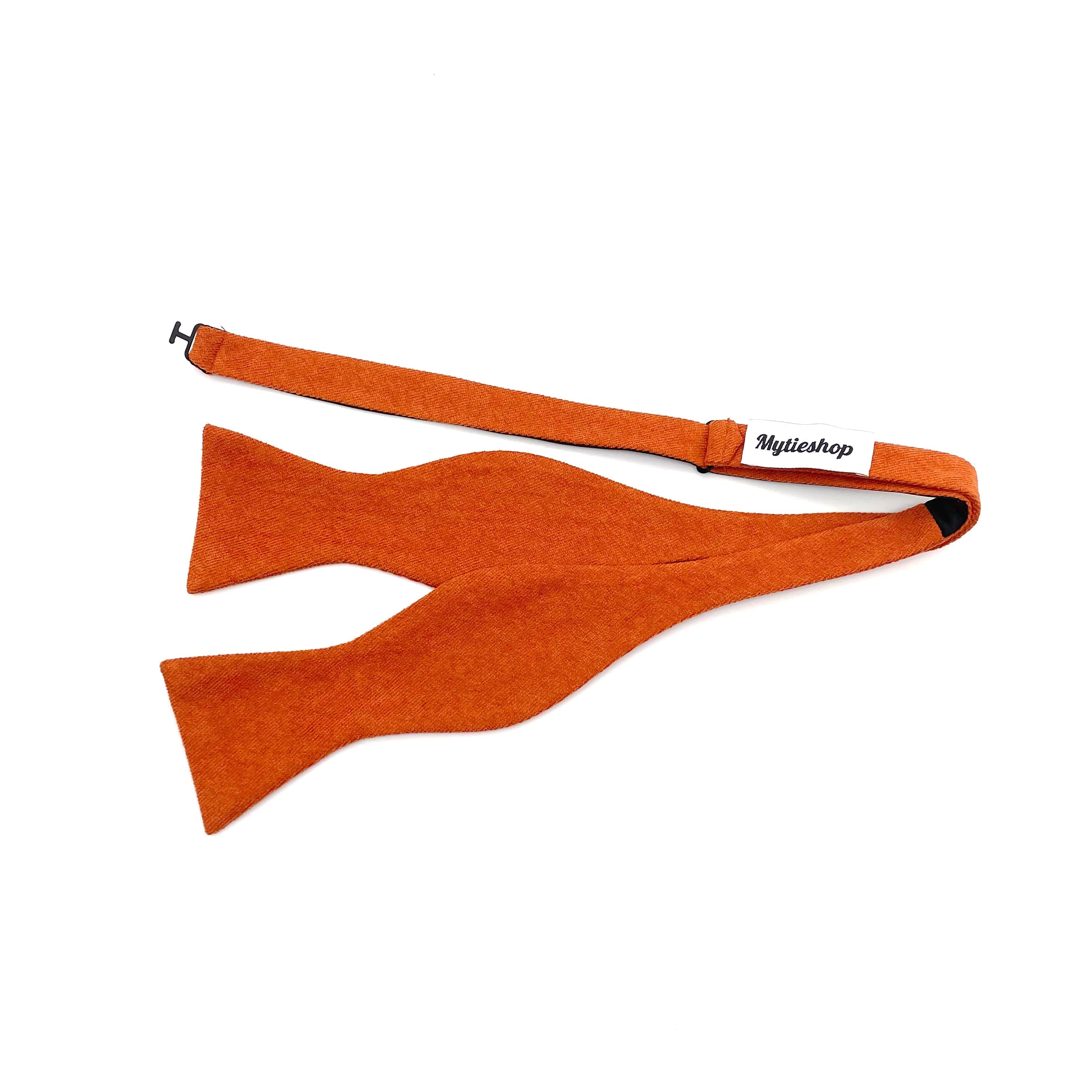 Rust Orange Bow Tie Self Tie SAFFRON MYTIESHOP-Rust Orange Bow Tie 100% Suede Handmade Adjustable to fit most neck sizes 13 3/4" - 18" Make a dapper statement at your next formal event with this rust orange bow tie. Handcrafted from premium suede, this bow tie has a luxurious feel that will have you looking and feeling your best. The perfect accessory for fall weddings, this bow tie will add a touch of sophistication to your outfit. Whether you're the groom or a member of the wedding party, this