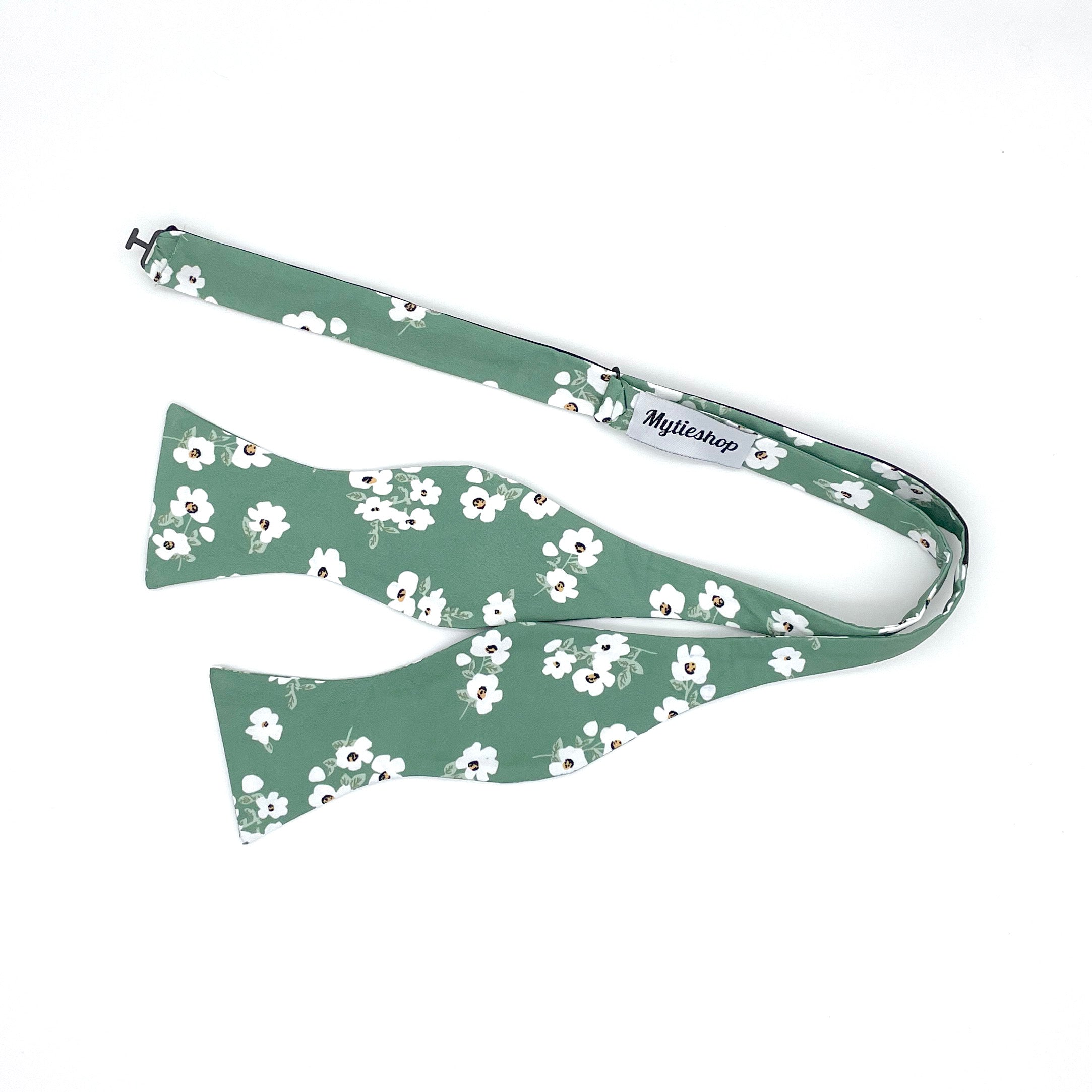 Sage Green Floral Bow Tie Men Self Tie - AUGUST - MYTIESHOP-Floral bow tie men - August floral bow tie - Color: Green 100% Cotton Flannel Handmade Adjustable to fit most neck sizes 13 3/4&quot; - 18&quot; Great for: Weddings Elopements Gift Anniversaries Events This beautiful bow tie is perfect for an elopement or wedding. The sage green and off white flowers on this bow tie make it perfect for a spring or summer wedding. The self tie bow tie makes it easy to adjust and fit to your size. This bow tie woul