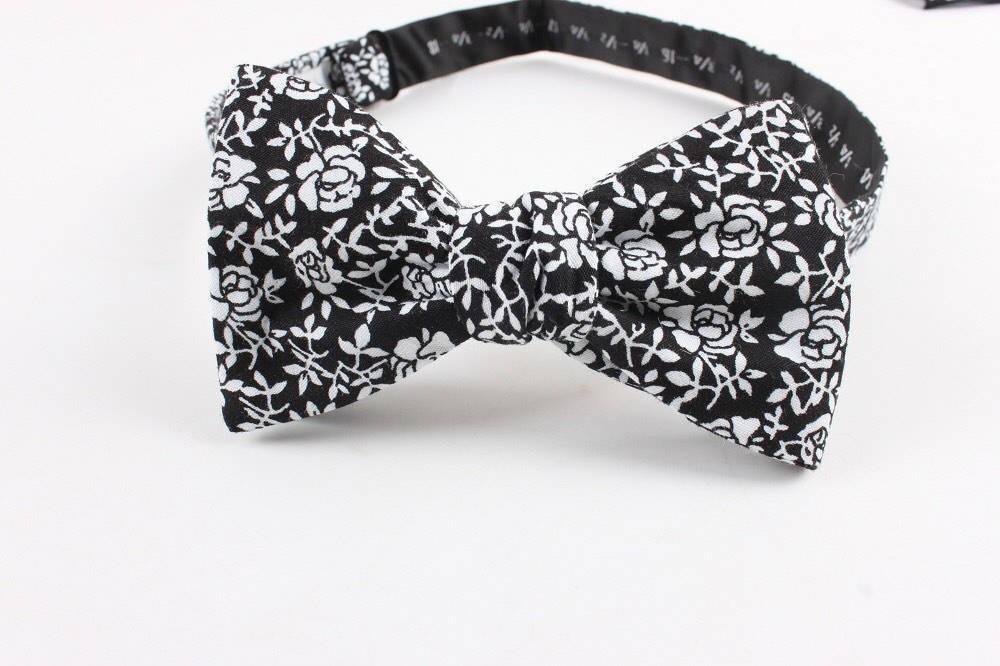 Suede Self Tie Bow Tie Mytieshop - ROSE-100% Cotton Flannel Handmade Adjustable to fit most neck sizes 13 3/4" - 18" Black base with white flowers Great for: Groom Groomsmen Wedding Shoots Formal Prom Fancy Parties Gifts and presents-Mytieshop