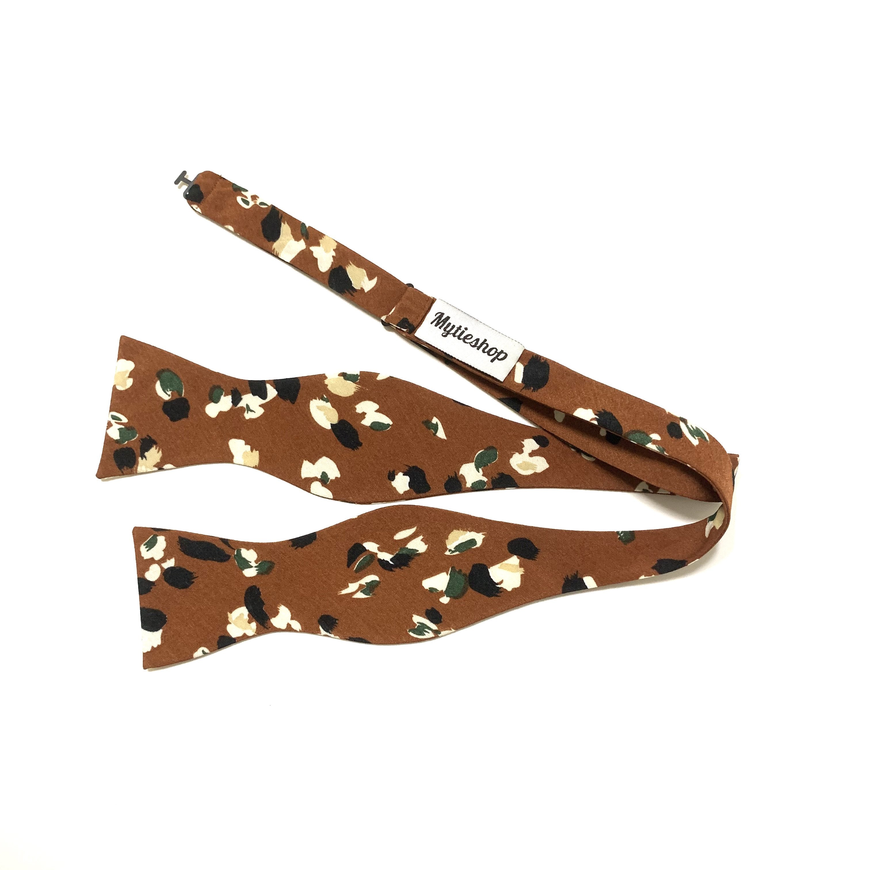 Terracotta Floral Bow Tie Self Tie PHOEBE - MYTIESHOP-Terracotta Floral Bow Tie Self Tie 100% Cotton Flannel Handmade Adjustable to fit most neck sizes 13 3/4" - 18" A dapper addition to any outfit, this PHOEBE bow tie is perfect for any formal occasion. With a floral pattern and self-tie design, this bow tie is perfect for taking your style up a notch. Whether you're dressing up for a wedding or dinner party, or just want a polished look for your next photo shoot, this bow tie will have you loo