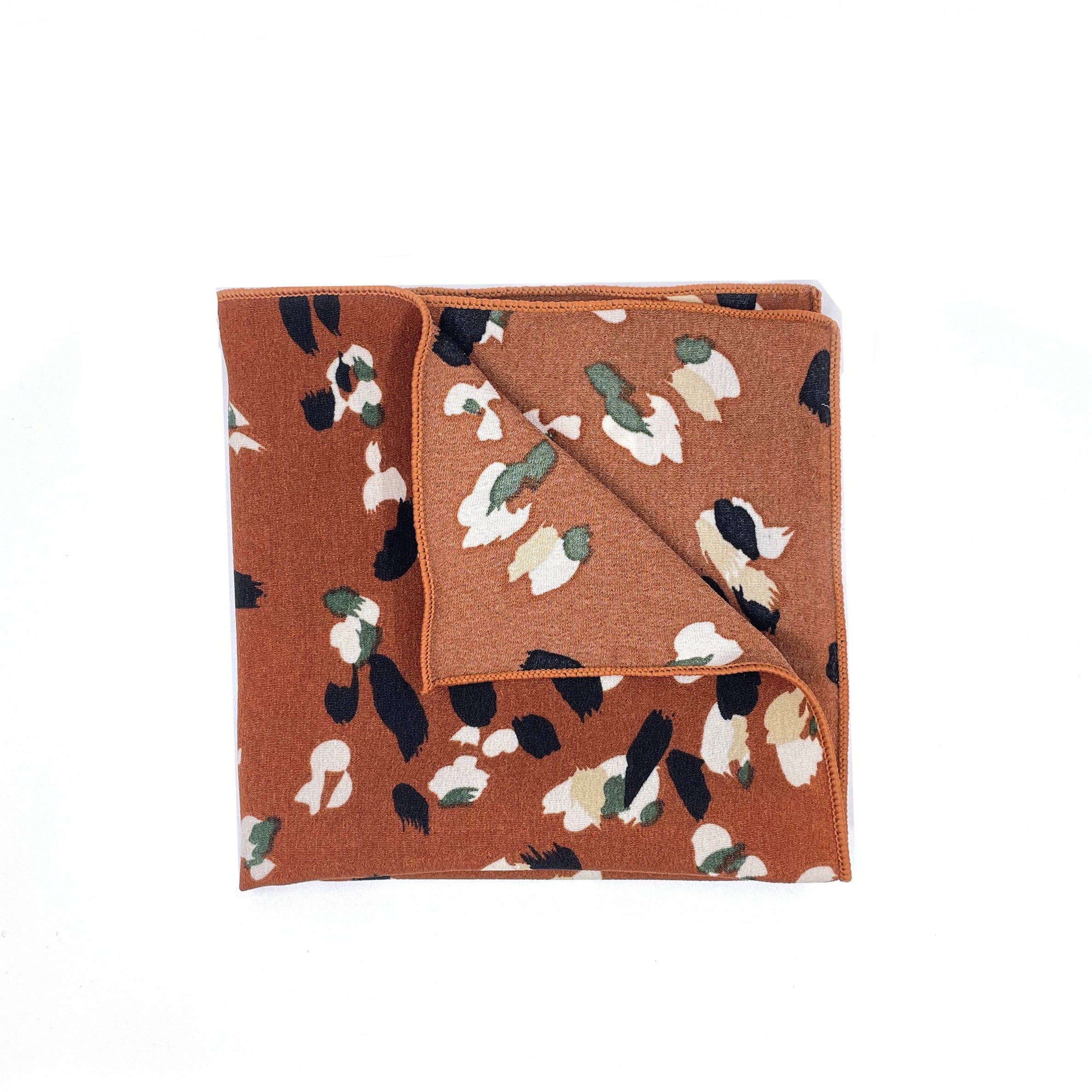 Terracotta Floral Pocket Square - Mytieshop - PHOEBE T Mytieshop Terracotta Floral Pocket Square Material CottonItem Length: 23 cm ( 9 inches)Item Width : 22 cm (8.6 inches) Color: Terracotta The PHOEBE is the perfect accessory to add a touch of elegance to your outfit. Made of 100% Silk, this pocket square is sure to make a statement. The intricate floral design is eye-catching and will surely turn heads. Whether you&#39;re dressing up for a special occasion or simply want to add a touch of sophist
