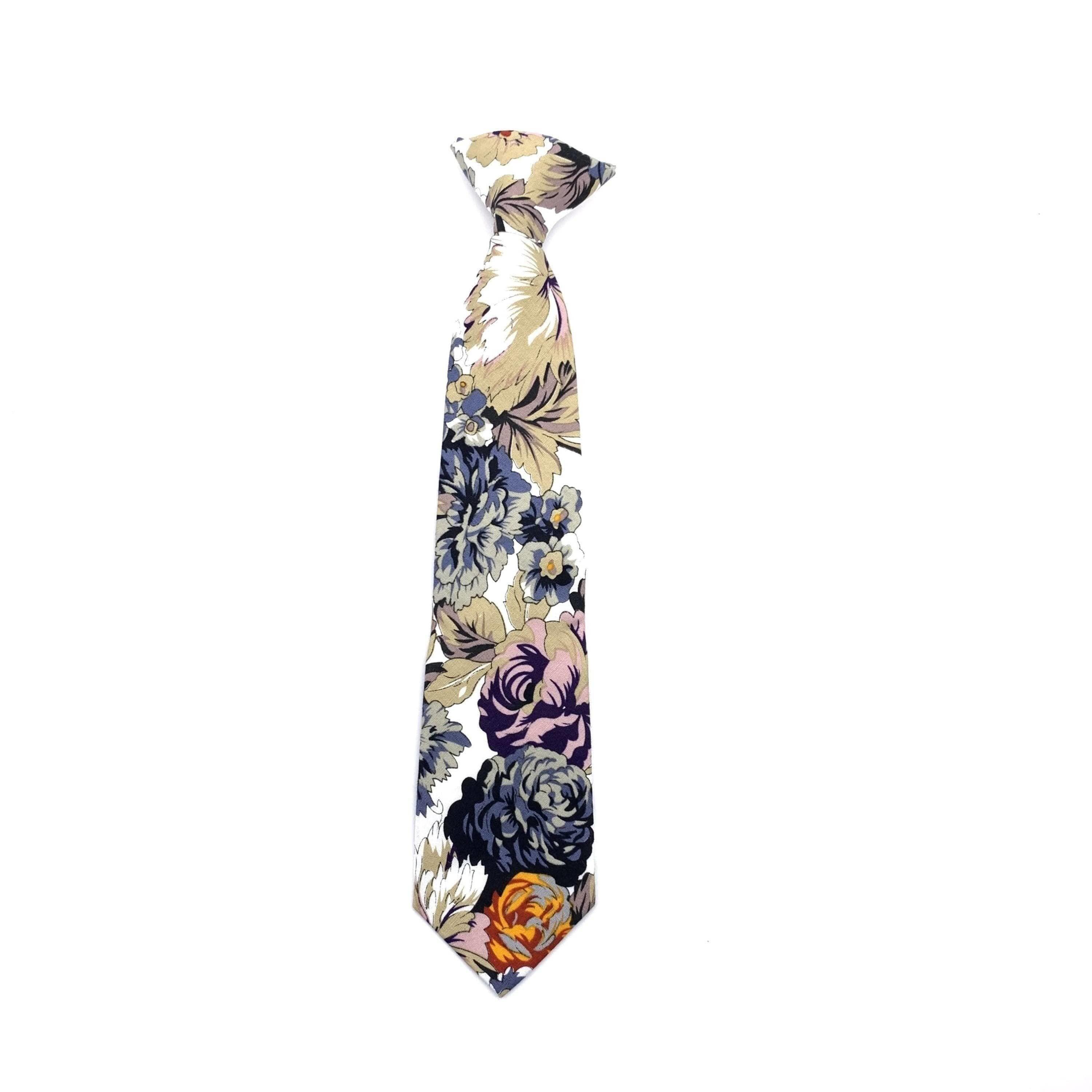 White Floral Clip On Tie for Kids DUKE-White Floral Clip On Tie Your little man will look so sharp in this dapper white floral clip on tie. This pre-tied tie is perfect for toddlers, kids and boys, and is adjustable to fit neck sizes up to 13 inches.This darling tie is perfect for special occasions or everyday wear. The tie is sweet and stylish, and the clip on design makes it easy to put on and take off. Make dressing up a breeze with this easy to wear clip on tie. Your little man will love fee
