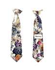 White Floral Clip On Tie for Kids DUKE-White Floral Clip On Tie Your little man will look so sharp in this dapper white floral clip on tie. This pre-tied tie is perfect for toddlers, kids and boys, and is adjustable to fit neck sizes up to 13 inches.This darling tie is perfect for special occasions or everyday wear. The tie is sweet and stylish, and the clip on design makes it easy to put on and take off. Make dressing up a breeze with this easy to wear clip on tie. Your little man will love fee